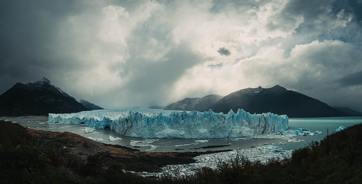 panorama of glacier perito moreno with cloudy skies in the distance