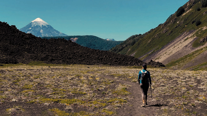Maxine hiking the Volcan Achen Ñiyeu trail with Volcán Lanín in the background. Parque Nacional Lanín, Argentina.