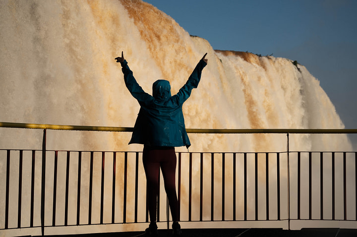 Maxine standing by one of the cascades on the Brasilian side of Iguazu Falls