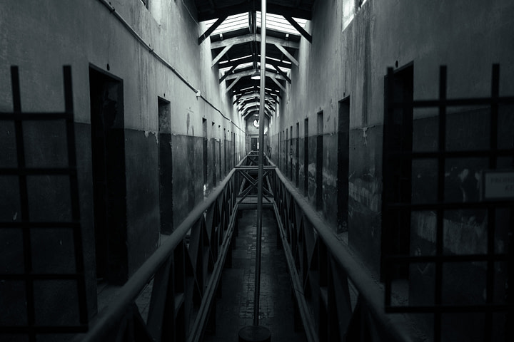 The Prison at the End of the World, looking down a corridor with various cells