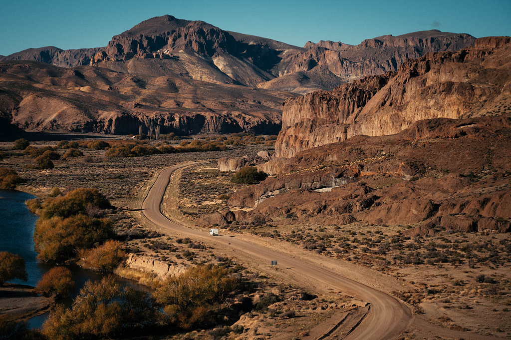 Campervan driving through Río Chubut Vallery near Piedra Parada and Cañadón La Buitrera canyon