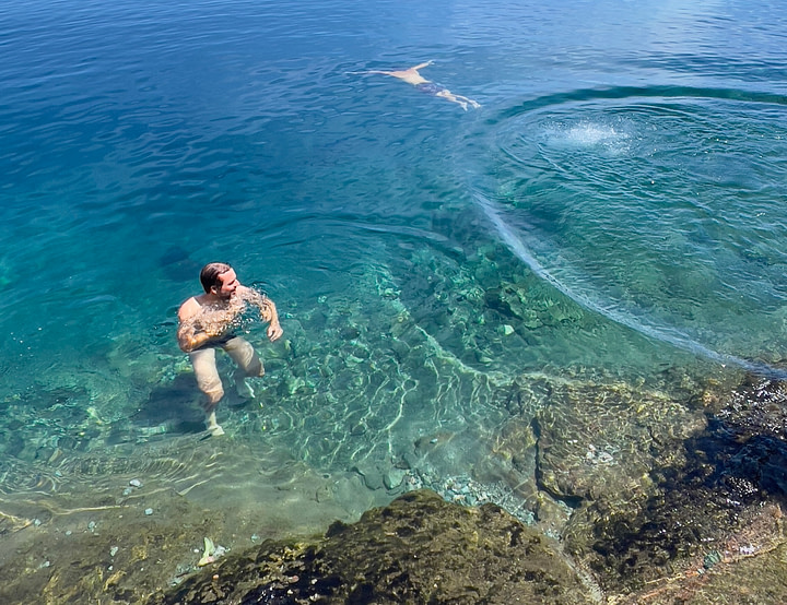 Theo wild swimming in Lake Nahuel Huapi near Bariloche, Argentina